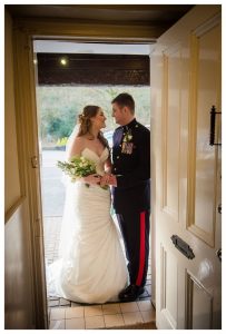 bride and groom in doorway