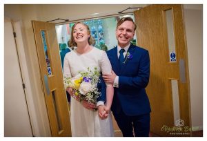 excited and relieved couple exit church