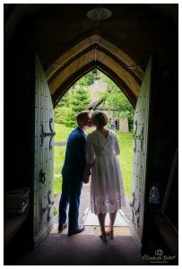 in doorway kissing