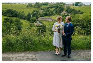 beautiful yorkshire view behind the couple