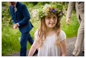 flower girl poses for camera