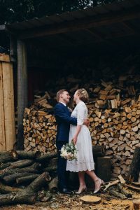 woodpile and wedding couple