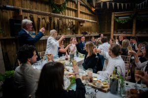 guests raise their glasses for the happy couple