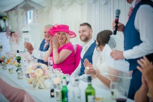 mother of the bride laughs during the speeches