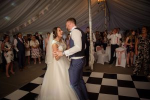 first dance in marquee watched by guests