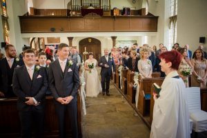 bride and dad walk down the aisle