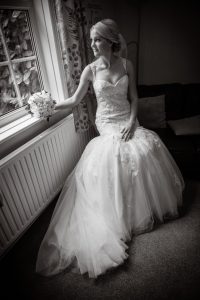 Bride seated black and white