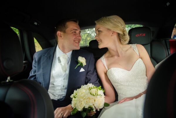 newlyweds get into wedding car