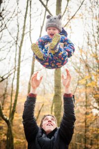 toddler being thrown in air
