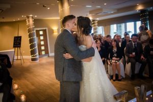 bride and grooms first kiss