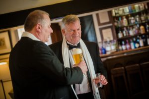 groom and best man having a pint