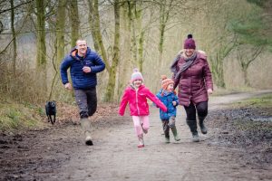 running along path family and dog