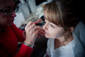 bride having her makeup done