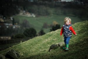 child on the hillside