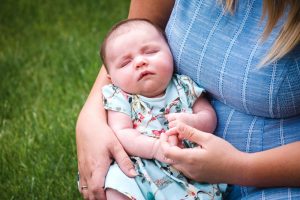 close up of baby in mothers arms