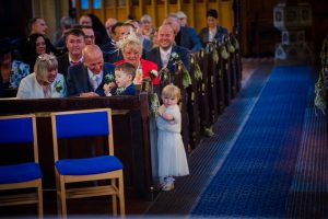 children play in the pews