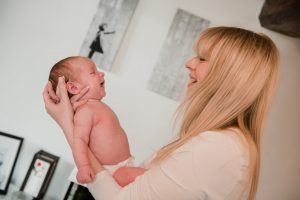 baby looking at mum smiling