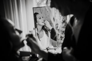 bride getting ready reflected in mirror