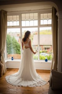 bride in the window at parent's house