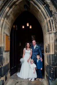 family photo in the doorway to church