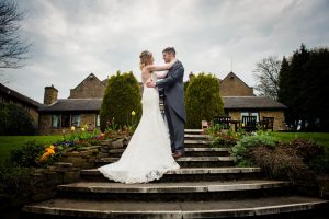 bride and groom at top of staircase