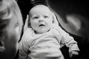 newborn looking at parents
