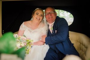 bride and father of the bride in the car