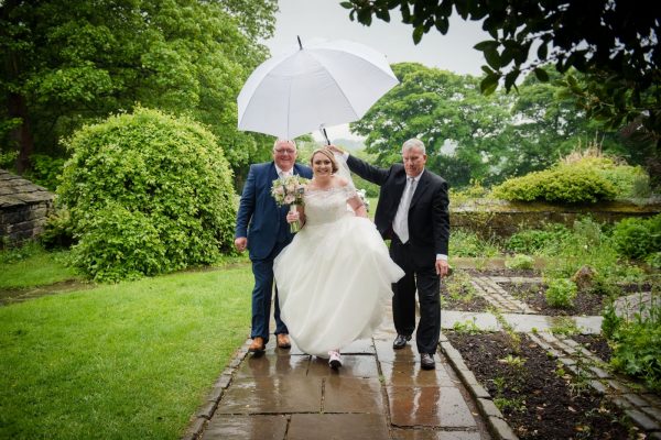oakwell hall in the rain bride under umbrella