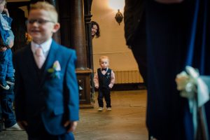 page boys enter ceremony room