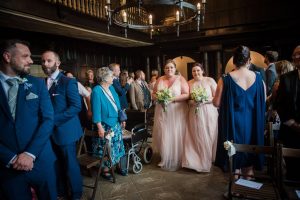bridesmaids walk down the aisle