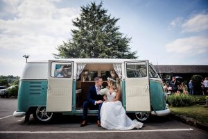 wedding campervan vw newlyweds captured in the doorway