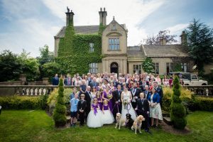 large group shot of all guests in front of the hall