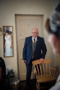 dad looks on as final preparations take place