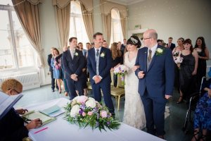 bride arrives at the side of the groom