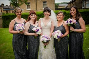 bridesmaids group photo loking at camera
