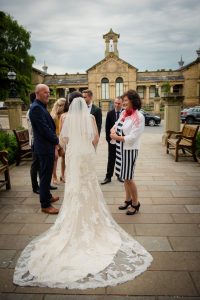 The bridal gown laid out outside the grand hall