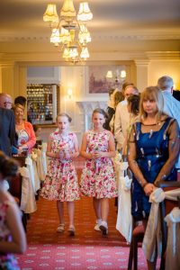 flower girls walk down the aisle
