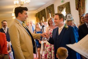 the grooms exchange rings