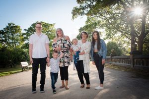 family posing in the evening sun