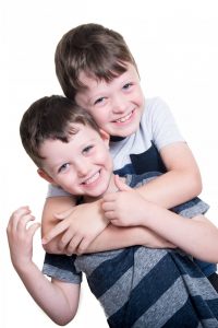 brothers having a cuddle