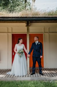 chalet doors framing the couple