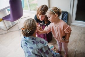 little girl helps with bridal prep