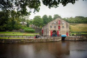 Standedge Visitors Centre wedding venue seen from across the canal