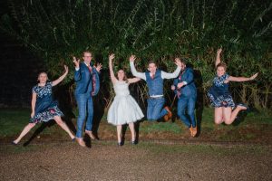 jumping photo of bridal party