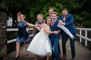 bridal party being silly at wedding
