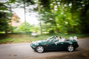 wedding car driving past