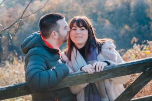 engaged couple kiss
