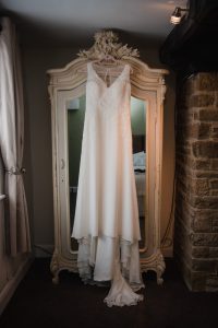 wedding dress hung at black horse