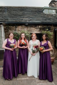 bride and bridesmaids pose