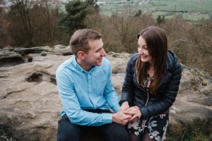 romantic Couple sitting on rock